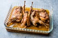 Roasted Crispy Quail Meat in Glass Bowl / Fried Small Chickens. Royalty Free Stock Photo