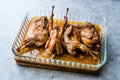 Roasted Crispy Quail Meat in Glass Bowl / Fried Small Chickens. Royalty Free Stock Photo