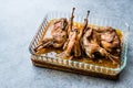 Roasted Crispy Quail Meat in Glass Bowl / Fried Small Chickens. Royalty Free Stock Photo