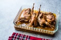 Roasted Crispy Quail Meat in Glass Bowl / Fried Small Chickens. Royalty Free Stock Photo