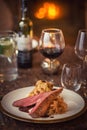 Roasted duck breast with cabbage and pancake served on white plate with glass of wine, winter and seasonal food, product photograp
