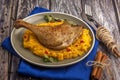 Roasted duck leg with pumpkin puree Royalty Free Stock Photo