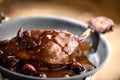 Roasted duck leg in red wine cherry sauce