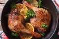 Roasted duck legs in a pan with oranges top view horizontal Royalty Free Stock Photo