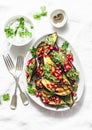 Roasted eggplant with feta, greek yogurt, cilantro sauce and pomegranate seeds on light background, top view. Delicious snack Royalty Free Stock Photo