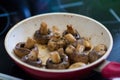 Roasted field mushrooms, champignons being cooked in frying pan Royalty Free Stock Photo