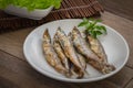 Roasted fish capelin or shishamo on plate