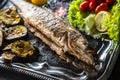 Roasted fish on dish with fresh and grilled vegetable Royalty Free Stock Photo