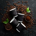 Roasted fragrant coffee beans on a black stone background. Top view.