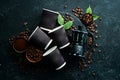 Roasted fragrant coffee beans on a black stone background. Top view. Free space for your text