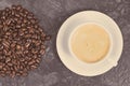 Roasted fragrant coffee grains and coffee with milk. Vintage photo