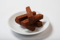 Roasted garlic croutons, black bread on a white plate. Royalty Free Stock Photo
