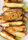 Roasted garlic potatoes vertical upclose Royalty Free Stock Photo