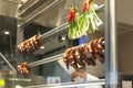 Roasted goose heads and necks hanging in a restaurant window in Hong Kong Royalty Free Stock Photo
