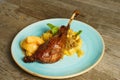 Roasted goose leg with cabbage papardelle pasta and quince compote