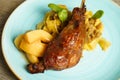 Roasted goose leg with cabbage papardelle pasta and quince compote