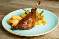 Roasted goose leg with cabbage papardelle pasta and quince compote