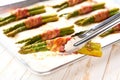 fried green asparagus wrapped in bacon close up. close-up of Bacon wrapped green asparagus bundles cooked on grill Royalty Free Stock Photo