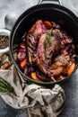 Roasted hare Haunches in stewpot with  Stewed Vegetables. Cooking stew. Top view Royalty Free Stock Photo