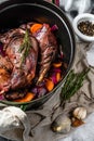 Roasted hare Haunches in stewpot with Stewed  Vegetables. Cooking stew. Top view Royalty Free Stock Photo
