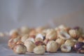 Roasted hazelnuts in a rustic scatter featuring whole and split filbert kernels with natural skin Royalty Free Stock Photo
