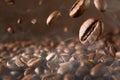 Roasted hot coffee beans falling on pile of coffee beans Royalty Free Stock Photo