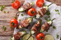 Roasted jalapeno peppers stuffed with cheese wrapped in bacon cl