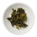Roasted kale chips in a bowl isolated on white background Royalty Free Stock Photo