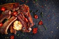 Roasted lamb cutlets ribs with garlic and herbs on stone background Royalty Free Stock Photo