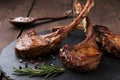 Roasted lamb ribs loin chop on a stone surface Royalty Free Stock Photo