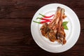 Roasted lamb ribs served on plate. Top view Royalty Free Stock Photo