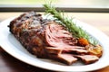 roasted lamb shankbone on a white dish Royalty Free Stock Photo