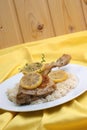 Roasted lemon chicken on some rice