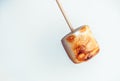 Roasted marshmallows on a skewer on white background Royalty Free Stock Photo