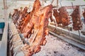 Roasted meat of beef cooking. Asado is traditional Argentine dis Royalty Free Stock Photo