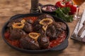 Roasted meat on the bone Osso Buco in tomato sauce Royalty Free Stock Photo
