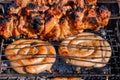 Roasted meat cooked at barbecue, closeup. Spicy marinated meat cook on bbq grill. Pork meat, shashlik, prepared on grill Royalty Free Stock Photo