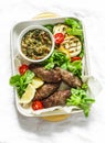 Roasted meat kebab , grilled vegetables sauce, zucchini, flatbread, green salad - delicious mediterranean style lunch on a light Royalty Free Stock Photo