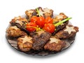 Roasted meat with pickled tomatoes garnished with fried potato stars
