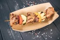 Roasted meat and vegetables taco wooden background. Mexican cuisine snacks, fast food of commercial kitchen