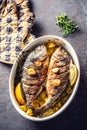 Roasted mediterranean fish bream with potatoes rosemary and lemon