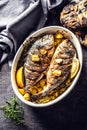 Roasted mediterranean fish bream with potatoes rosemary and lemon