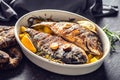 Roasted mediterranean fish bream with potatoes rosemary and lemon