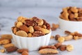 Roasted mixed nuts in white ceramic bowl Royalty Free Stock Photo