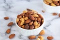 Roasted mixed nuts in white ceramic bowl