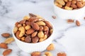 Roasted mixed nuts in white ceramic bowl