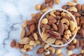Roasted mixed nuts in white ceramic bowl Royalty Free Stock Photo