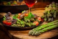 Roasted mushrooms with green asparagus Royalty Free Stock Photo