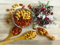 Roasted Natural Almond Nuts Badam and Cashew in a porcelain bowl and Christmas home decoration. Royalty Free Stock Photo