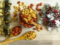 Roasted Natural Almond Nuts Badam and Cashew in a porcelain bowl and Christmas home decoration. Royalty Free Stock Photo